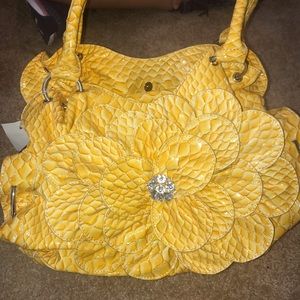 Yellow Purse with a  Yellow Flower on the Front